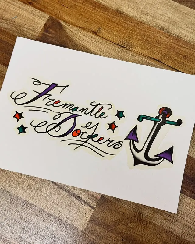 Script lettering with an anchor tattoo